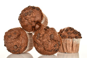 Chocolate muffins, close-up, isolated on a white background.