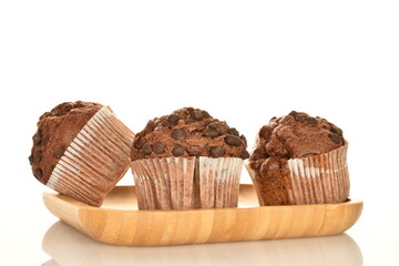 Chocolate muffins, close-up, isolated on a white background.