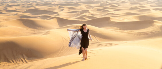 Cheerful free girl runs in the desert. The joy of freedom, the concept of a free happy life away from city life.