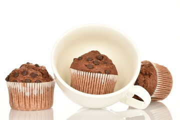 Chocolate muffins, close-up, isolated on a white background.