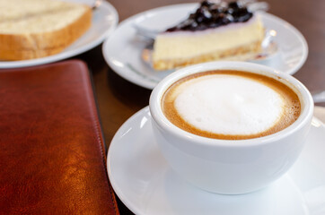 hot coffee with cake in coffee shop for breakfast.