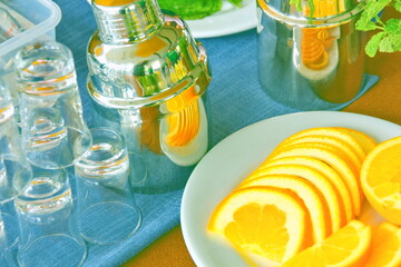 the bartender equipment and acessory shaker, glass ,orange mint on counter