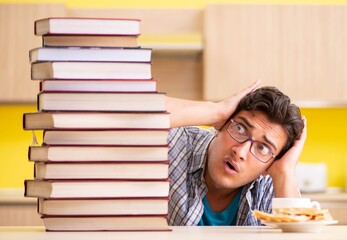 Student preparing for exam sitting at the kitchen