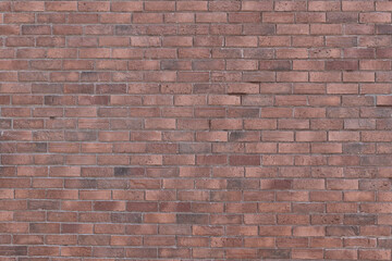 Red old brick wall texture grunge background with vignetted corners to interior design