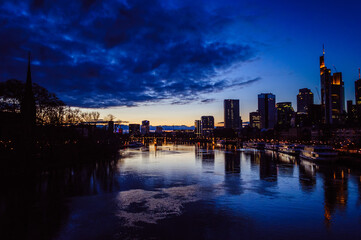 Fototapeta na wymiar Spectacular view on the night city of Frankfurt reflecting in the river
