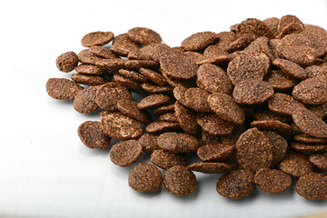 Breakfast cereal balls with chocolate on a white background