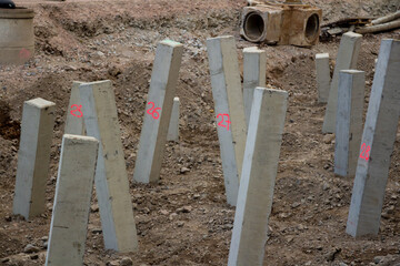Construction site with support structure of numbered concrete pillars