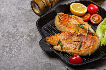 Delicious fried chicken breast and vegetable salad