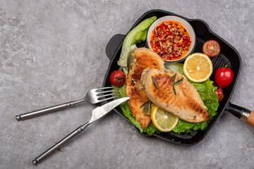 Delicious fried chicken breast and vegetable salad