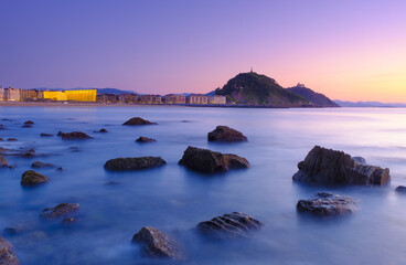 Obraz premium Zurriola beach sunset, Donostia city coast, San Sebastian, Euskadi