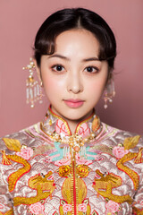 Beautiful Asian costume woman in pink background