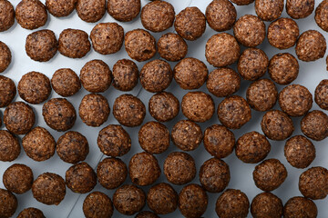 Breakfast cereal balls with chocolate on a white background