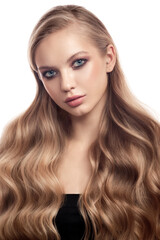 Portrait of a blonde girl with long beautiful wavy hair