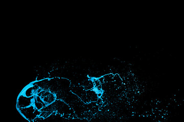 Blue color paint splash isolated on black background