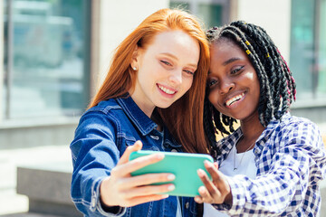 redhaired ginger white woman and her best friens making self photos on camera