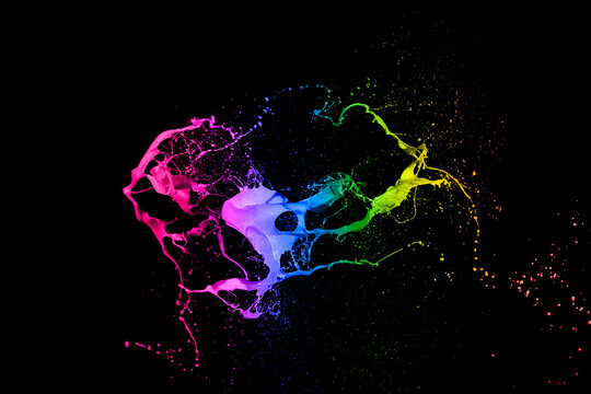 mixed colorful paint splash isolated on black background