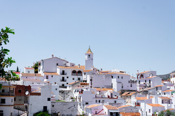 Aerial view of a white village in Spain with a church