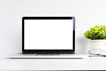 Laptop computer with blank screen in office