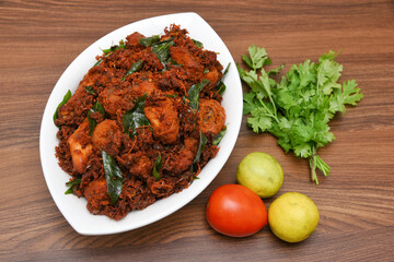 Fried chicken Kebab, Kerala Chicken fry or 65 is hot and spicy crispy chicken dish South India. Non vegetarian starter or quick snack. A popular authentic roasted dish deep fried Indian spices.