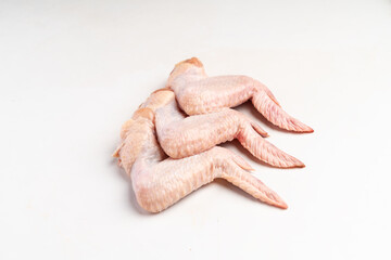 Fresh chicken wings on white background