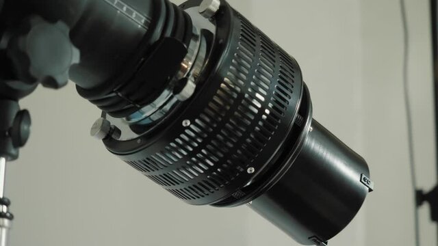 Lighting flash with a special attachment is in the photo Studio