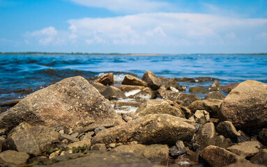Sea, coast, stone Beach, water splashes Cool summer day