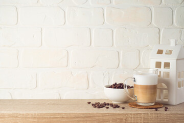 Kitchen background with coffee cup and house decor on wooden shelf