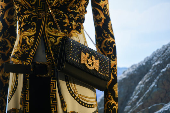 Milan, Italy - January 11, 2020: Black and golden Versace leather purse detail on a mannequin