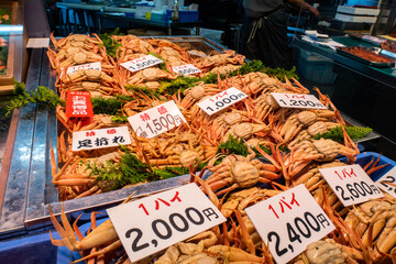 KANAZAWA, Japan. Market stall with big fresh crabs in traditional Omicho Fish Market in Kanazawa. 