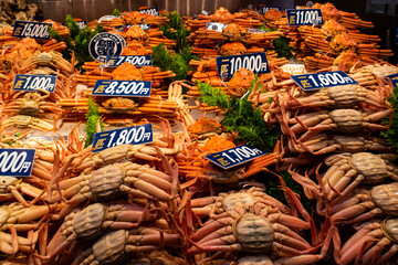 KANAZAWA, Japan. Market stall with big crabs in traditional Omicho Fish Market in Kanazawa. On the labels there are prices in japanese. © Cleop6atra