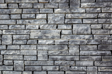 gray brick wall with rough texture