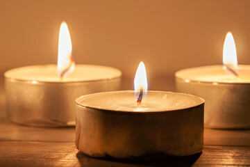 Three light candles with fire meditative relaxing macro wallpaper