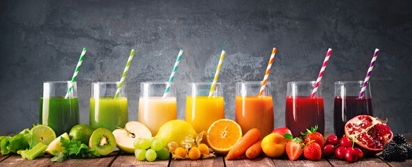 Assortment of fresh fruits and vegetables juices in rainbow colors
