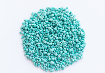 Green different shape chemical fertilizer granules.