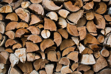 chopped wood prepared for winter, wooden blocks background