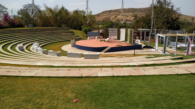 Amphitheater in an open sky and air surrounded by hills.