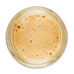 Delicious honey in a glass jar isolated on a white background. View from the top.
