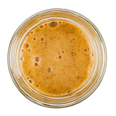 Honey with sea buckthorn in a glass jar. Isolated on a white background. View from the top.