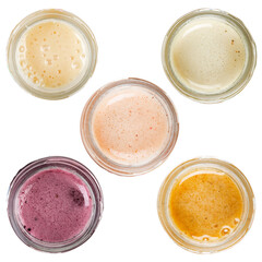 Honey of different types in glass jars. Isolated on a white background. View from the top.