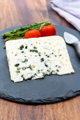 French cheeses collection, piece of roquefort, sheep milk soft blue cheese from Southern France.
