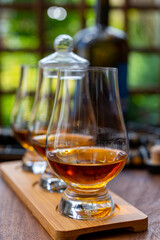 Tasting of Scotch whisky in traditional old British house with wooden windows