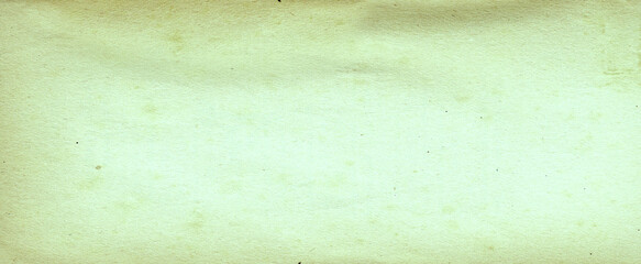 Abstract yellow green background with soft bright gold center glowing with light colors and dark blue green border with blurred mottled texture