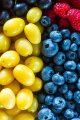 Mix of yellow and blue berries. Summer mick fruit. Berry layout