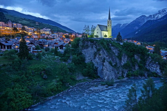 church in the alps night Scuol Switzerland