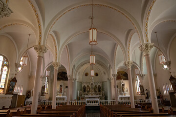 Fototapeta premium Catholic Church interior with gorgeous arches and beautiful pews