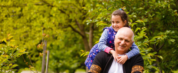 Beautiful granddaughter visiting her elderly kind grandfather.