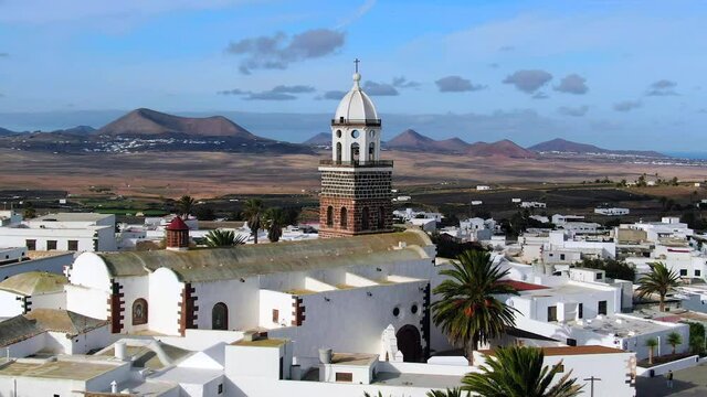 Spain, Canary Islands, Lanzarote, Teguise, Church of Our Lady of Guadalupe and Volcanic mountain landscape