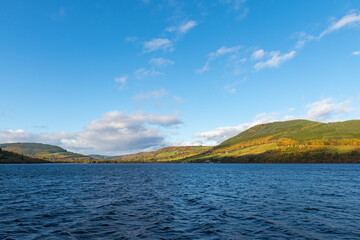 Blue sky over the legendary Loch Ness lake on a sunny autumn day