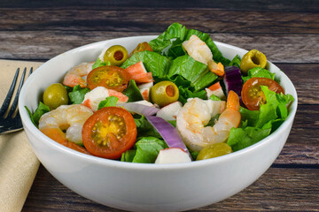 salad top with shimp and crabmeat