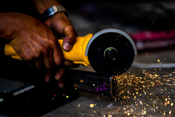 Industrial Worker labourer at the factory welding steel structure